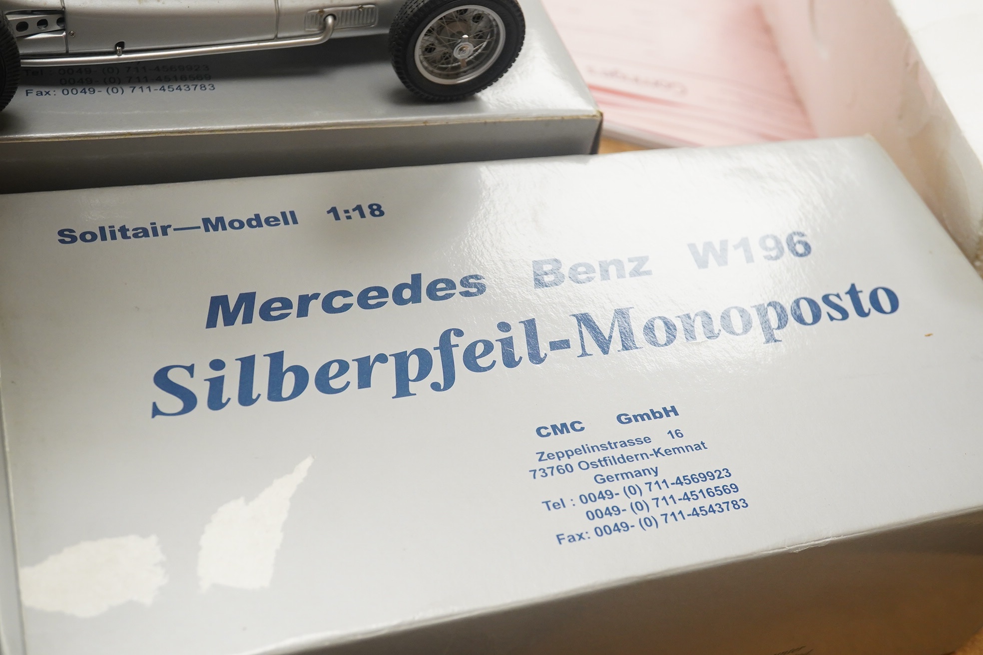 Two boxed CMC 1:18 scale diecast model cars; a Mercedes-Benz W196, together with a Mercedes-Benz W154 1938. Condition - fair to good, and slight metal fatiguing to the bonnet on the W196 as occasionally found with early